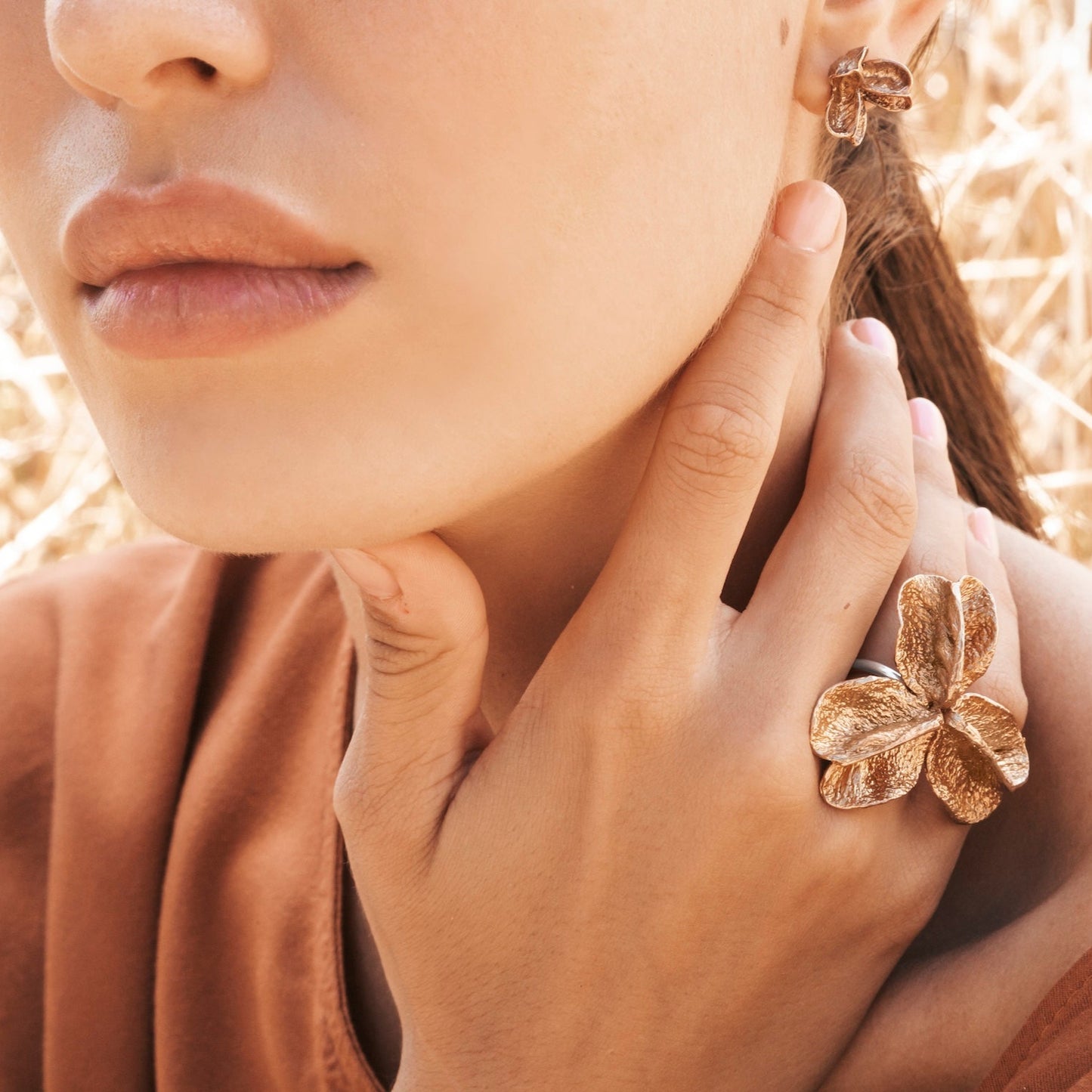 Bronze XL Pod Ring and Large Bronze Pod Studs on Model