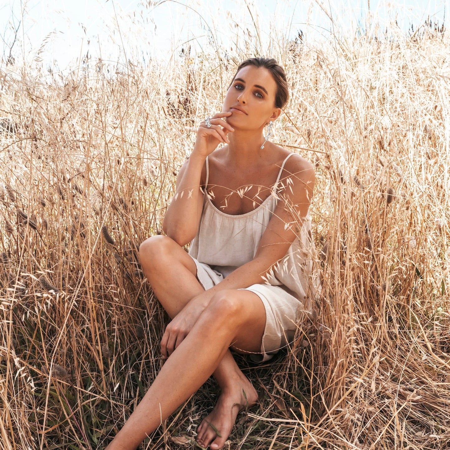 Silver Spikethorn Statement Earrings and Silver Statement Ring on model in the Grass