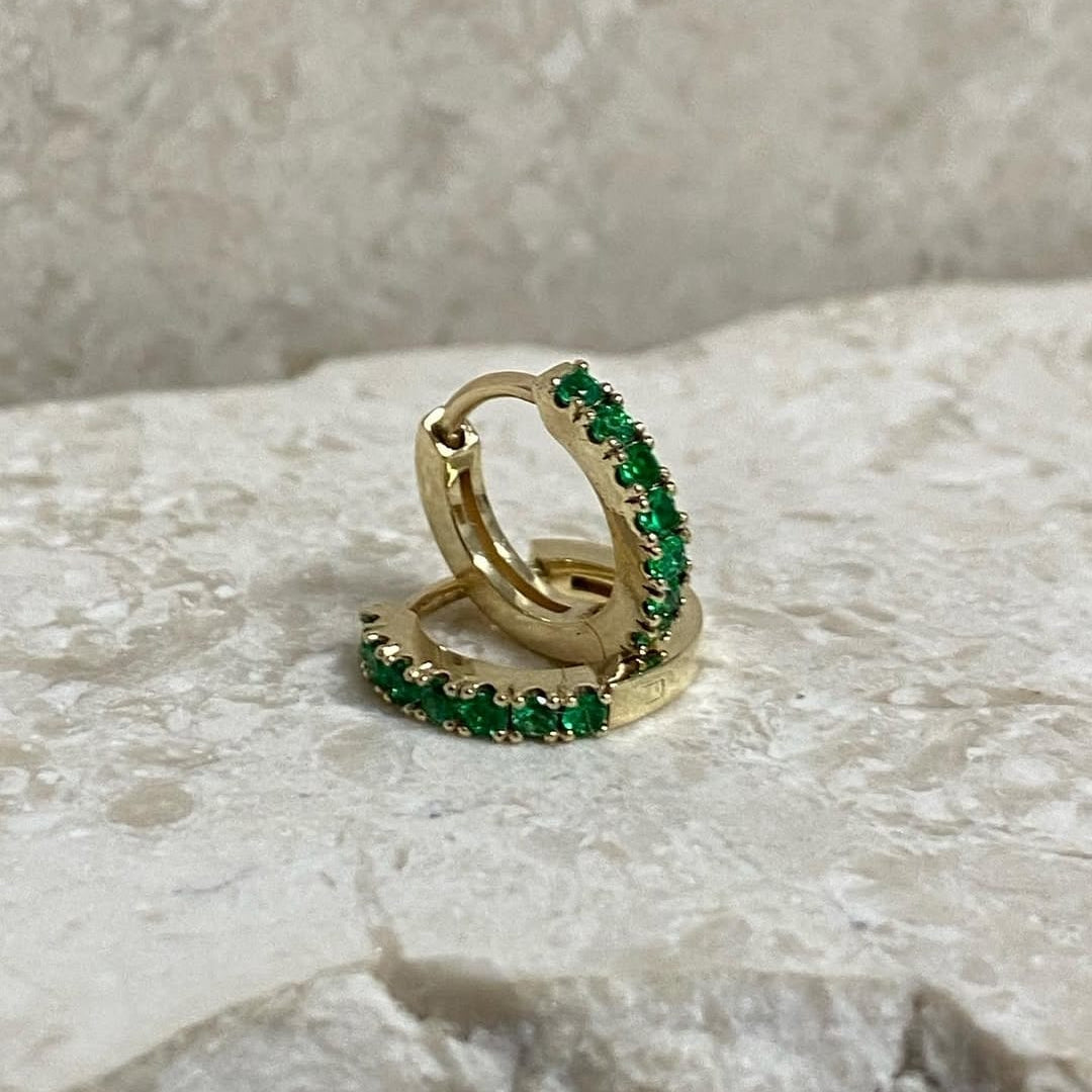 Yellow gold and emerald huggies