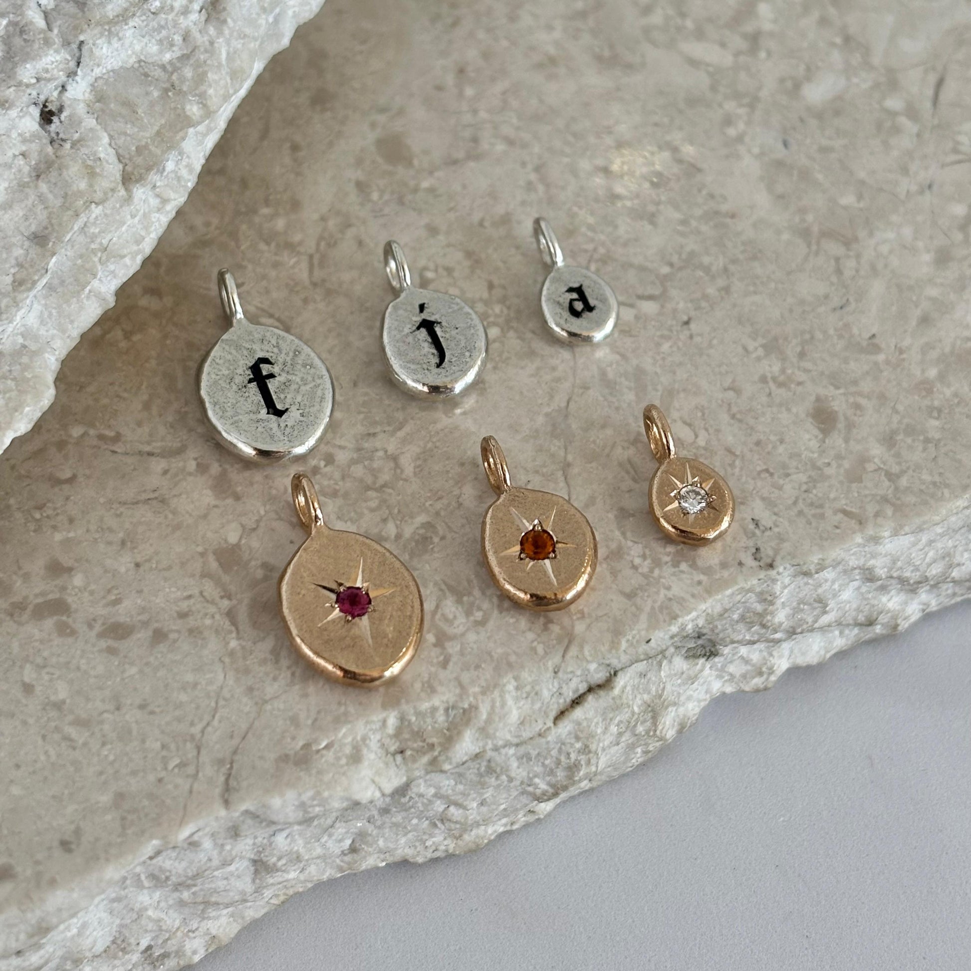 Story pendants small, medium and large sterling silver and bronze story pendants with gothic-style letters and sparkling birthstones