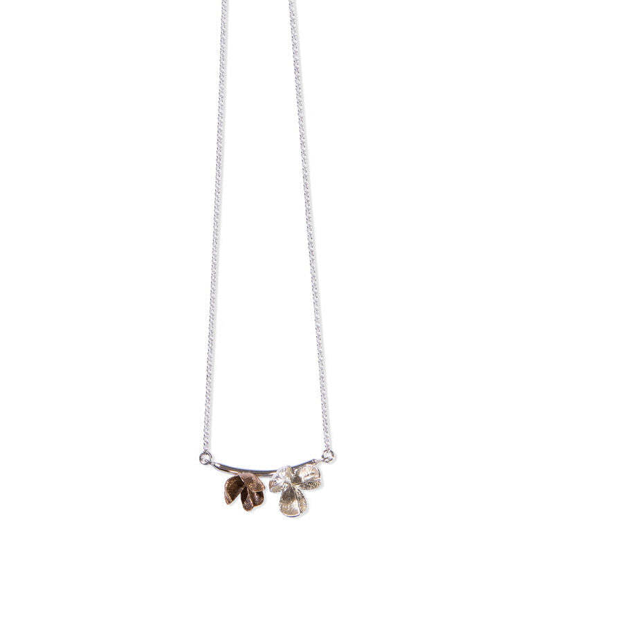 silver and bronze spikethorn pod curved bar necklace by Tiffany Marx
