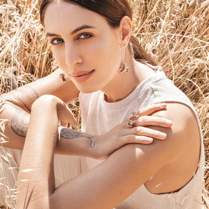 Large  Long Bronze Spikethorn Hook Earrings and Bronze Double Pod Ring on Model by Tiffany Marx