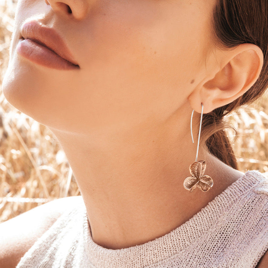 Large long bronze Spikethorn hook earrings on model by Tiffany Marx