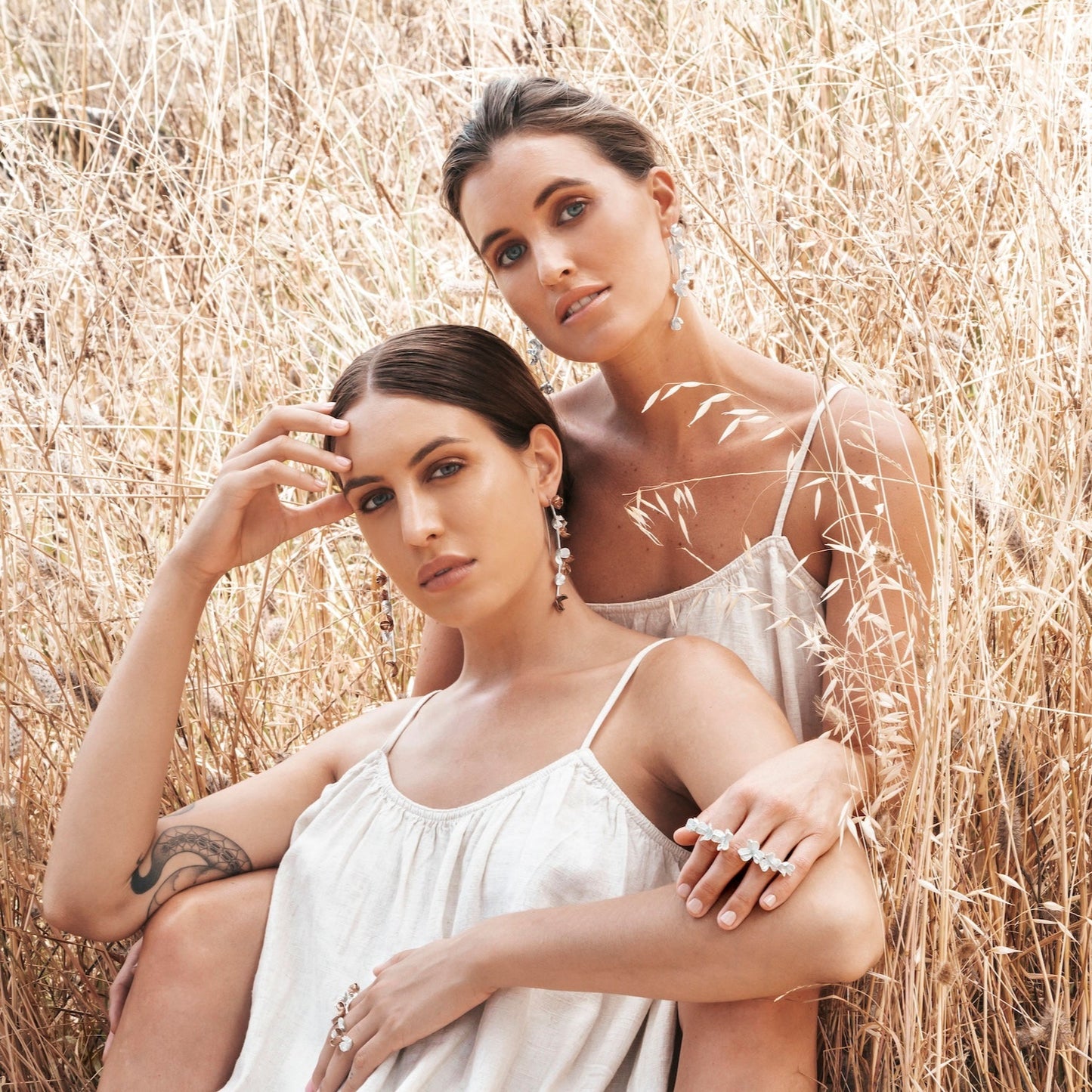 Silver and Two-Tone Spikethorn Statement Bar Rings and Earrings on models by Tiffany Marx