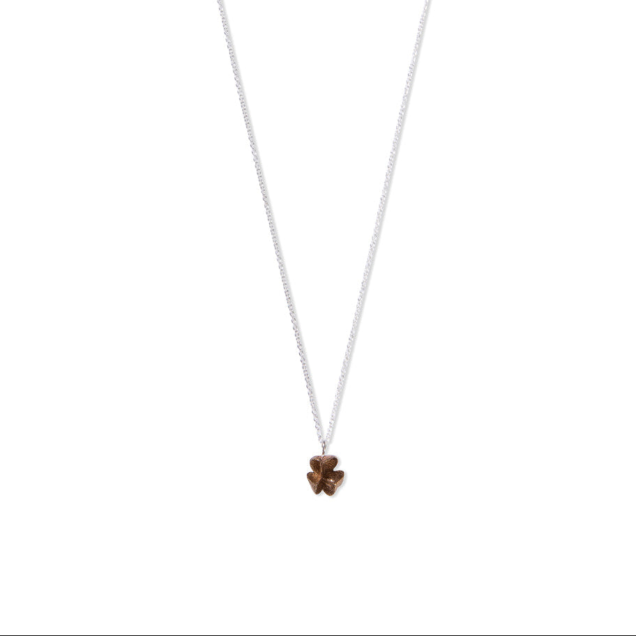 small bronze spikethorn pod pendant by Tiffany Marx on a silver chain