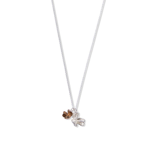 Larger silver and smaller bronze spikethorn double pendant