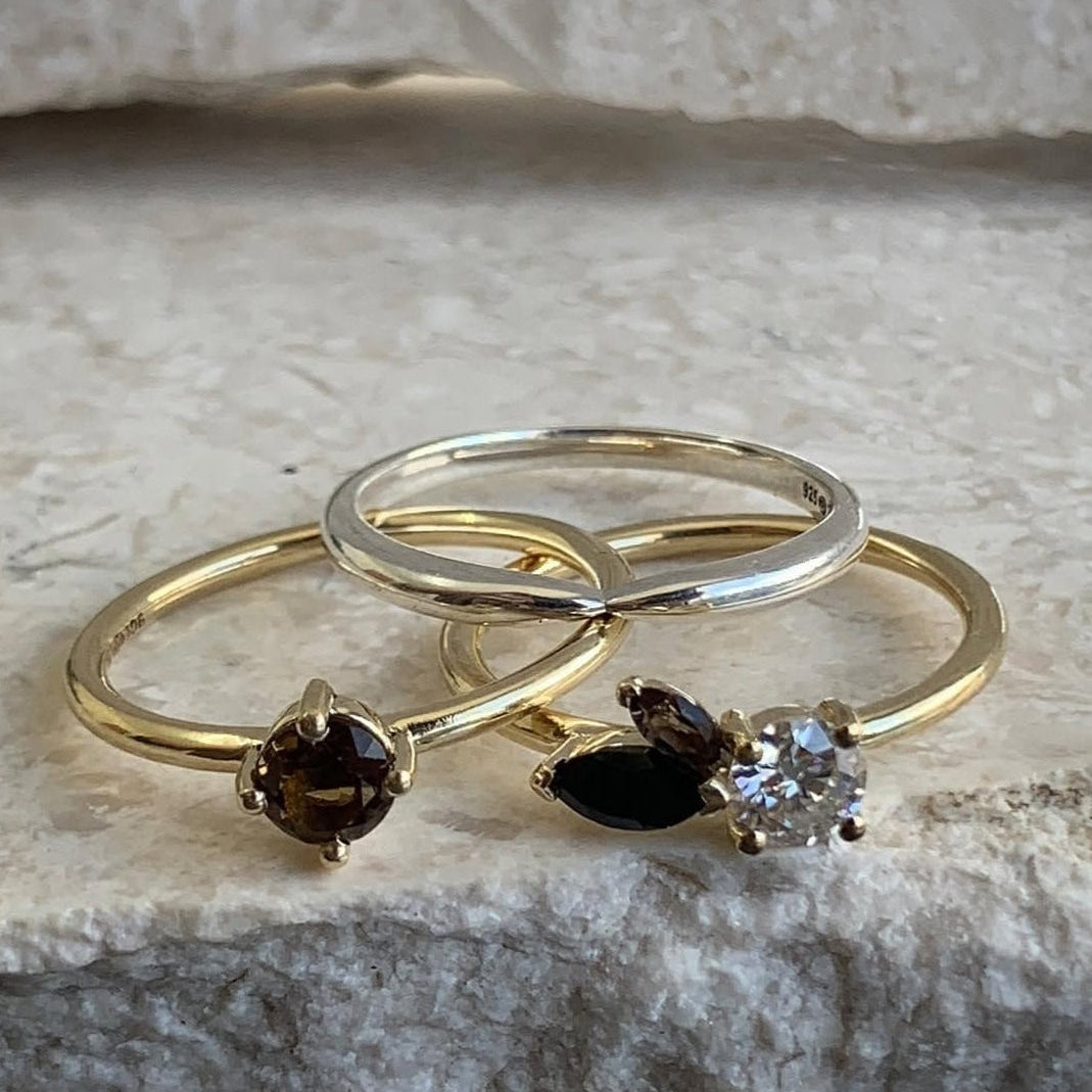 Tiffany Marx stack rings featuring smoky quartz, gold, silver band and diamond detail