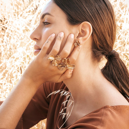 Bronze Double XL Spikethorn Pod Ring and Large Bronze Spikethorn Studs on model by Tiffany Marx